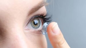closeup woman putting on Ortho-K Lenses What Are They & How Do They Improve Your Vision Overnight