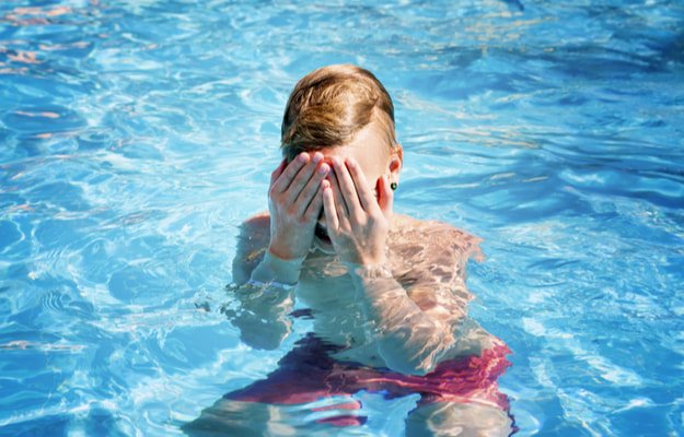 teenager having irritating eyes in pool Is It Safe To Swim With Contact Lenses