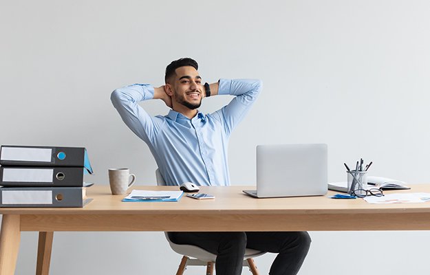 man-relaxing-on-chair-sitting-at-table-Take-Breaks-When-Using-a-Computer-ss-body