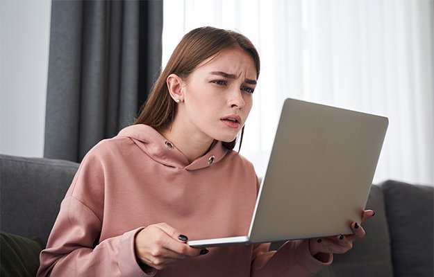 Teenager-squinting-her-eyes-while-using-laptop-Symptoms-as-body